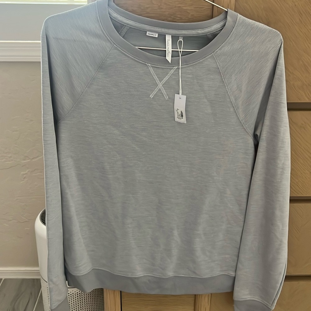 TravisMathew’s women’s crew neck sweater